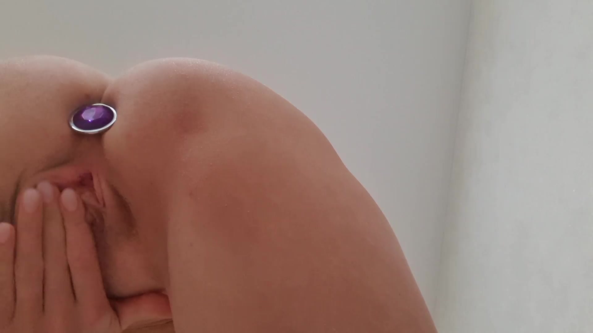 Stepsister with anal plug masturbates tight pussy close-up